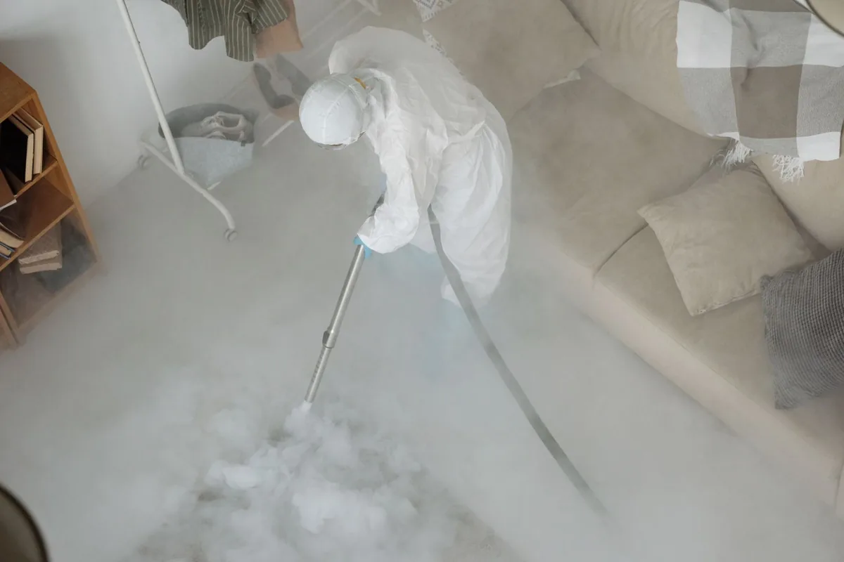 Biohazard cleanup technician in protective equipment, Maple Lake, MN